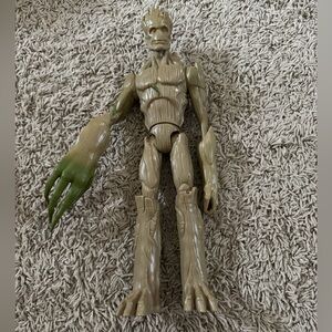 Groot action figure with extendable legs.